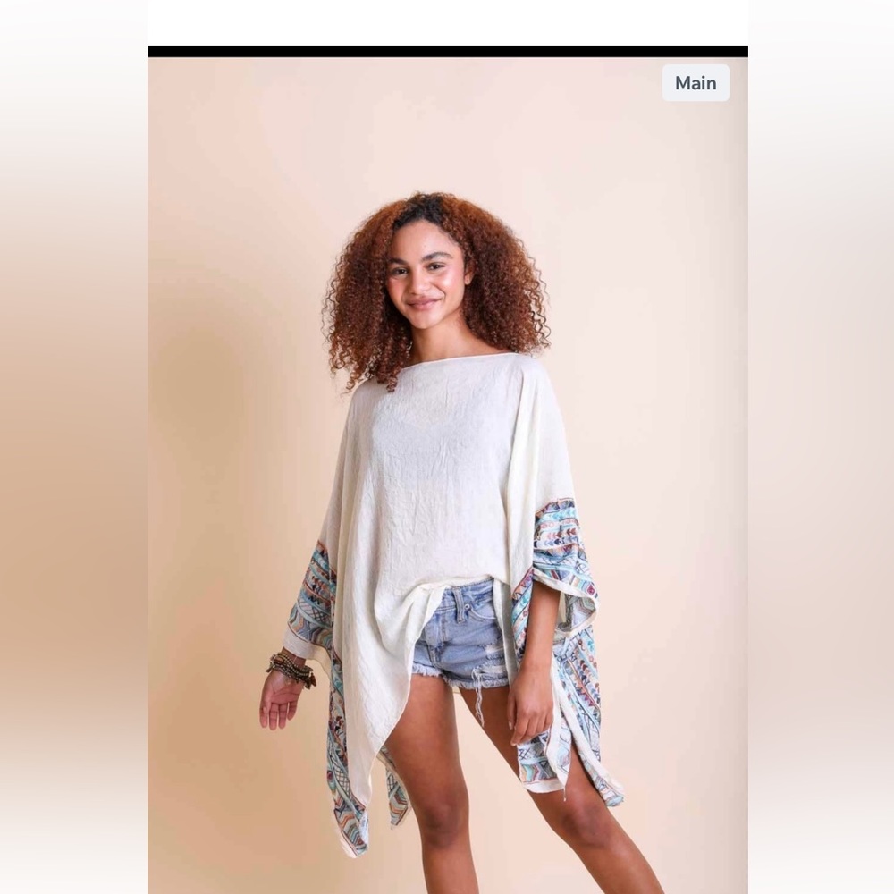 White pull over with embroidered sleeves